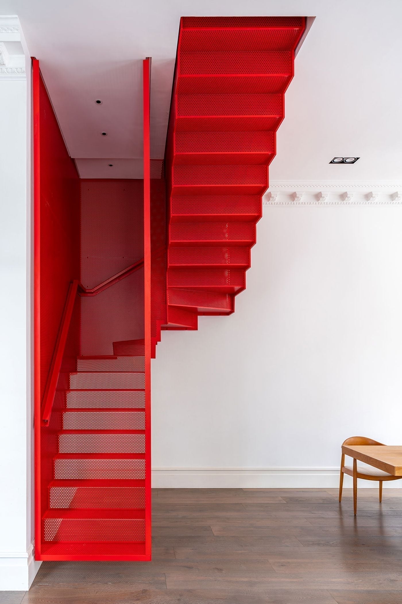 A red staircase is never just a staircase