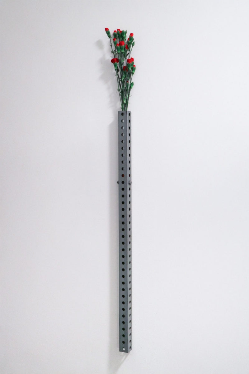 Perforated wall vase