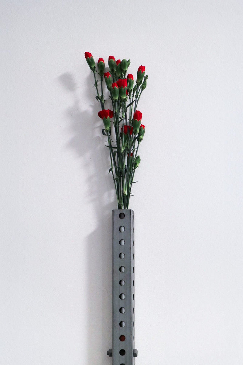Perforated wall vase